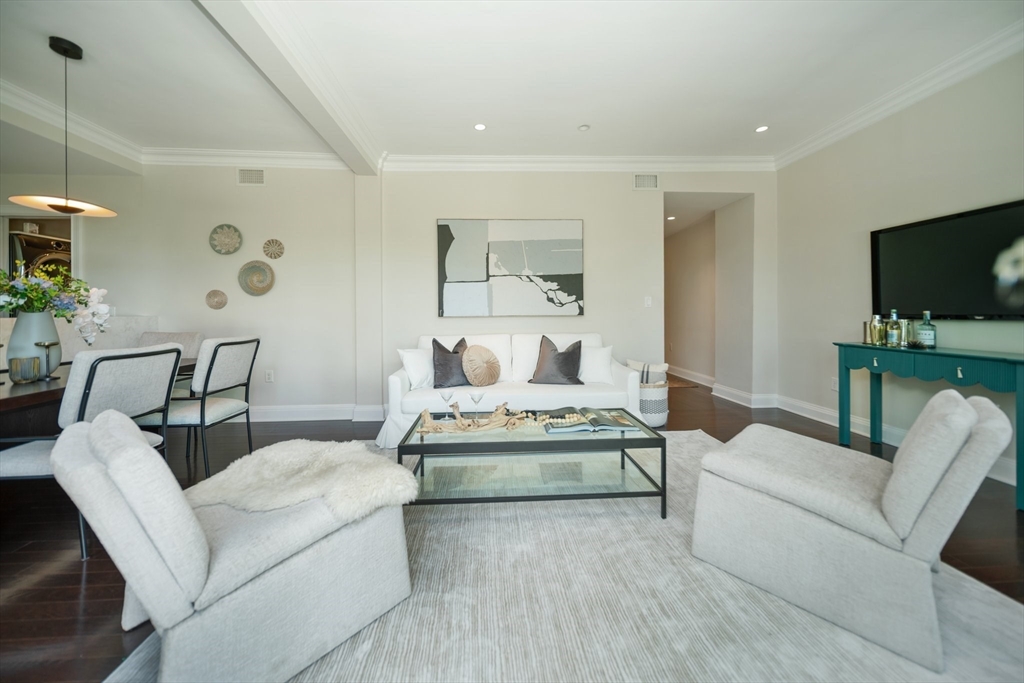 56 Commonwealth Avenue, Unit PH Boston, MA 02116 - Photo 5 of 33 a living room with furniture and a flat screen tv