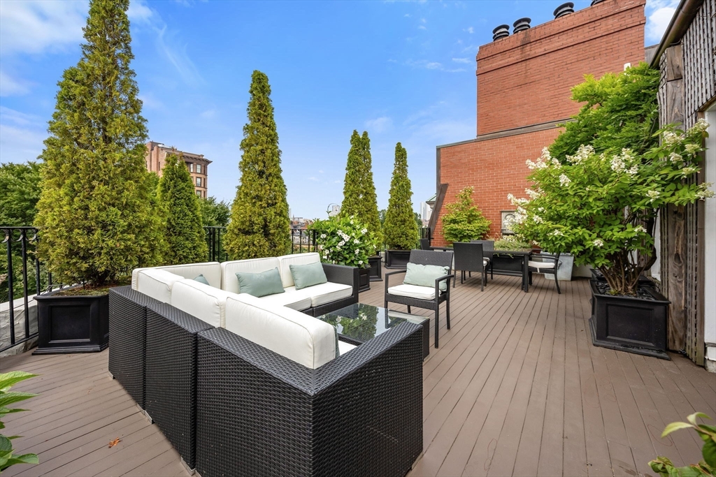 56 Commonwealth Avenue, Unit PH Boston, MA 02116 - Photo 9 of 33 a view of a patio with couches and potted plants