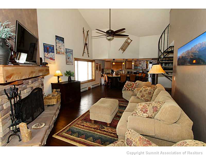 860 Copper Road, Unit 410 Frisco, CO 80443 - Photo 4 of 18 Living Room. Huge vaulted ceilings in the livingroom add an incredible element of space. The wood burning firaplace offers the added element of warmth.