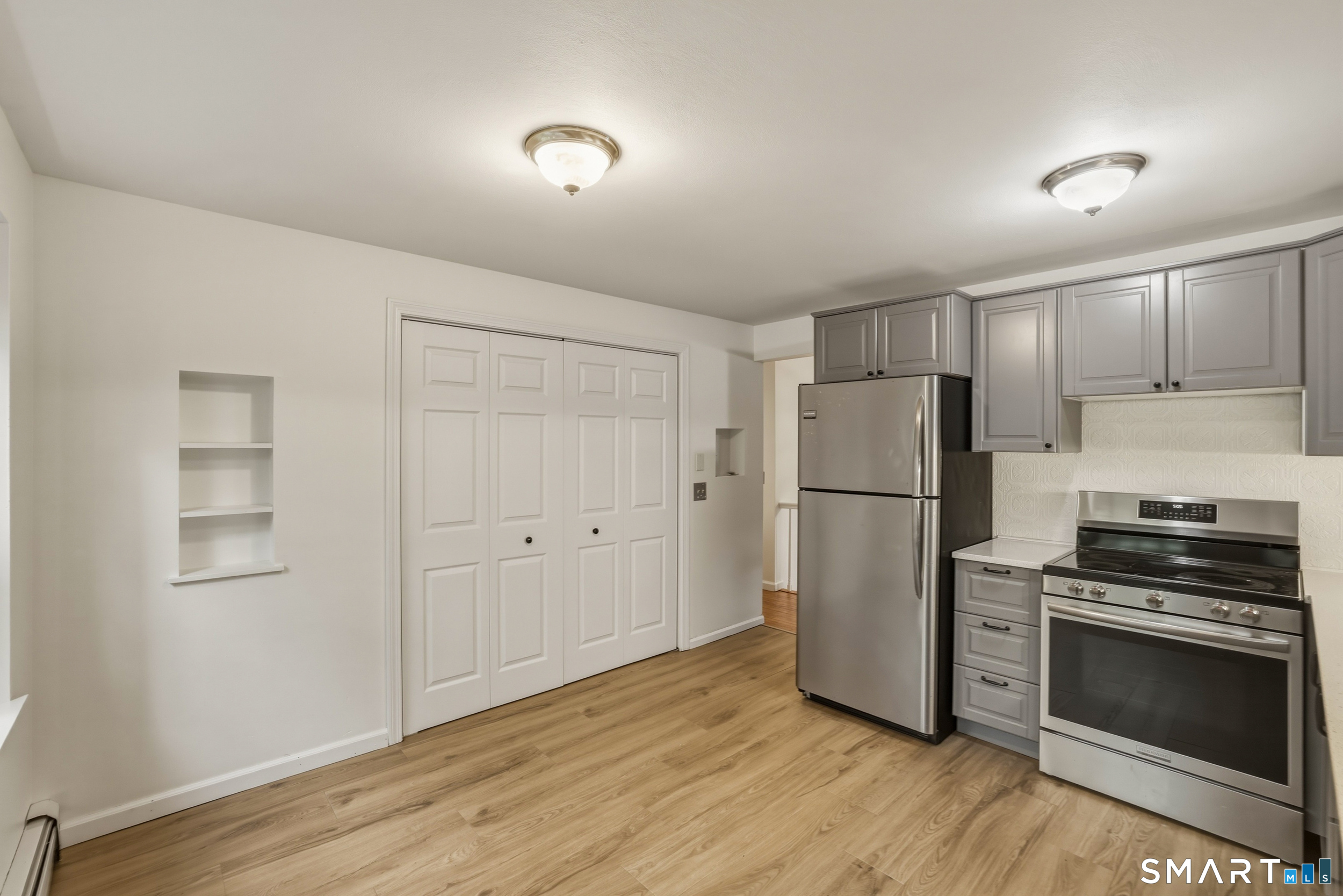 10 Salem Road Madison, CT 06443 - Photo 11 of 31 The centrally located large pantry makes cooking meals easy and accessible with plenty of room to add an island or kitchen table.