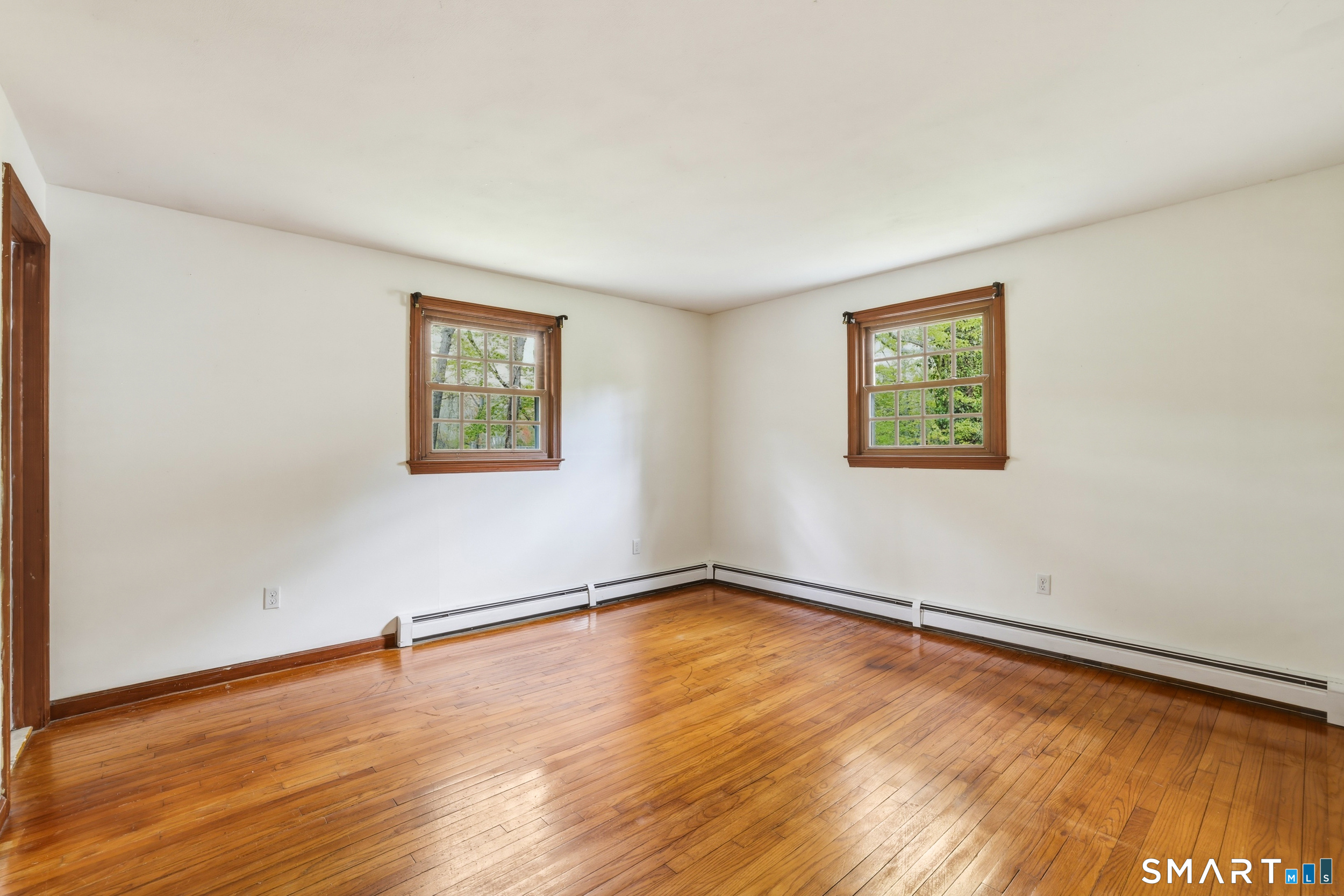 10 Salem Road Madison, CT 06443 - Photo 13 of 31 An abundance of natural light flows into this room through three large windows.