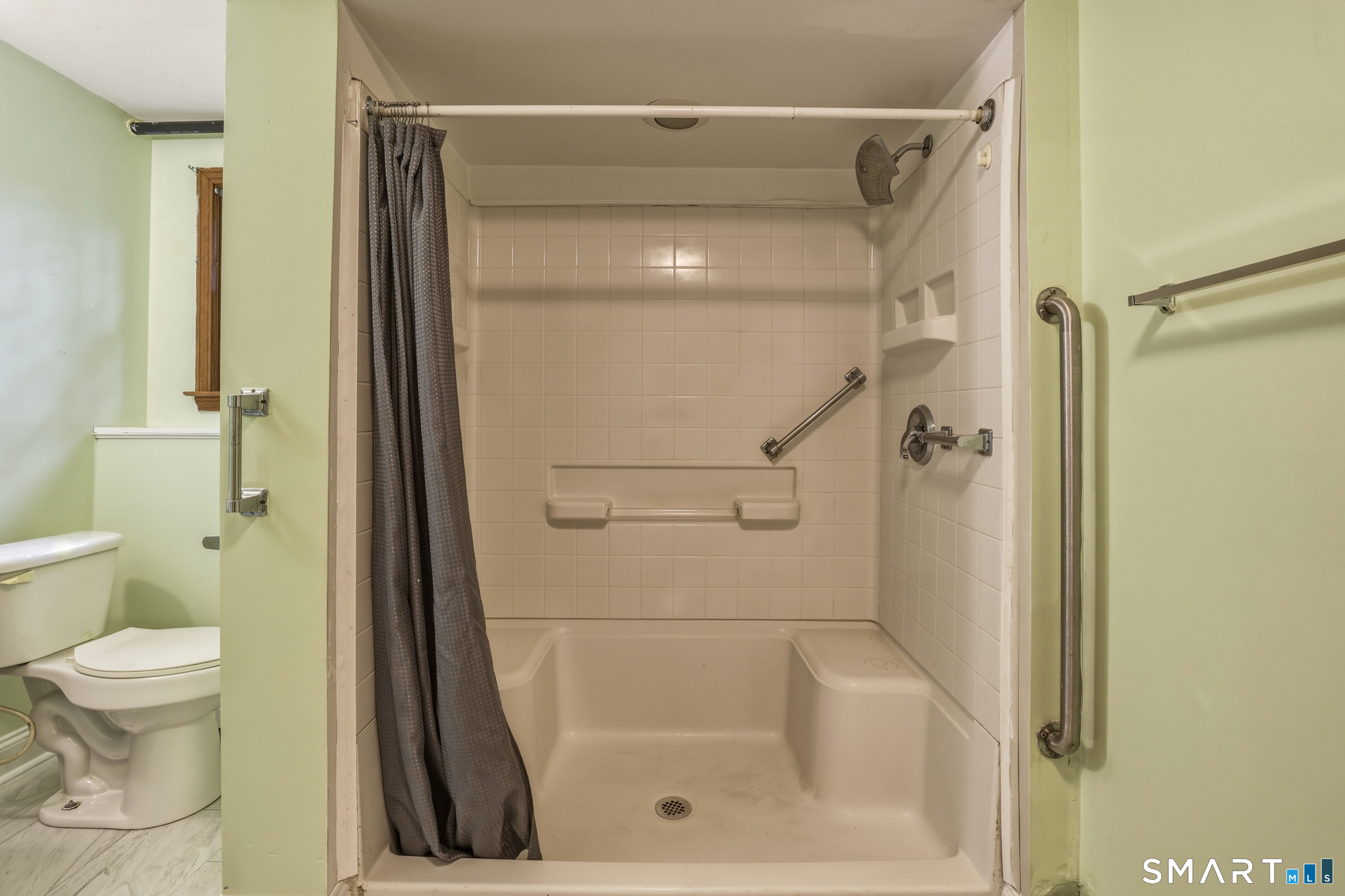 10 Salem Road Madison, CT 06443 - Photo 27 of 31 This thoughtfully laid out Full Bathroom features a large and accessible stall shower.