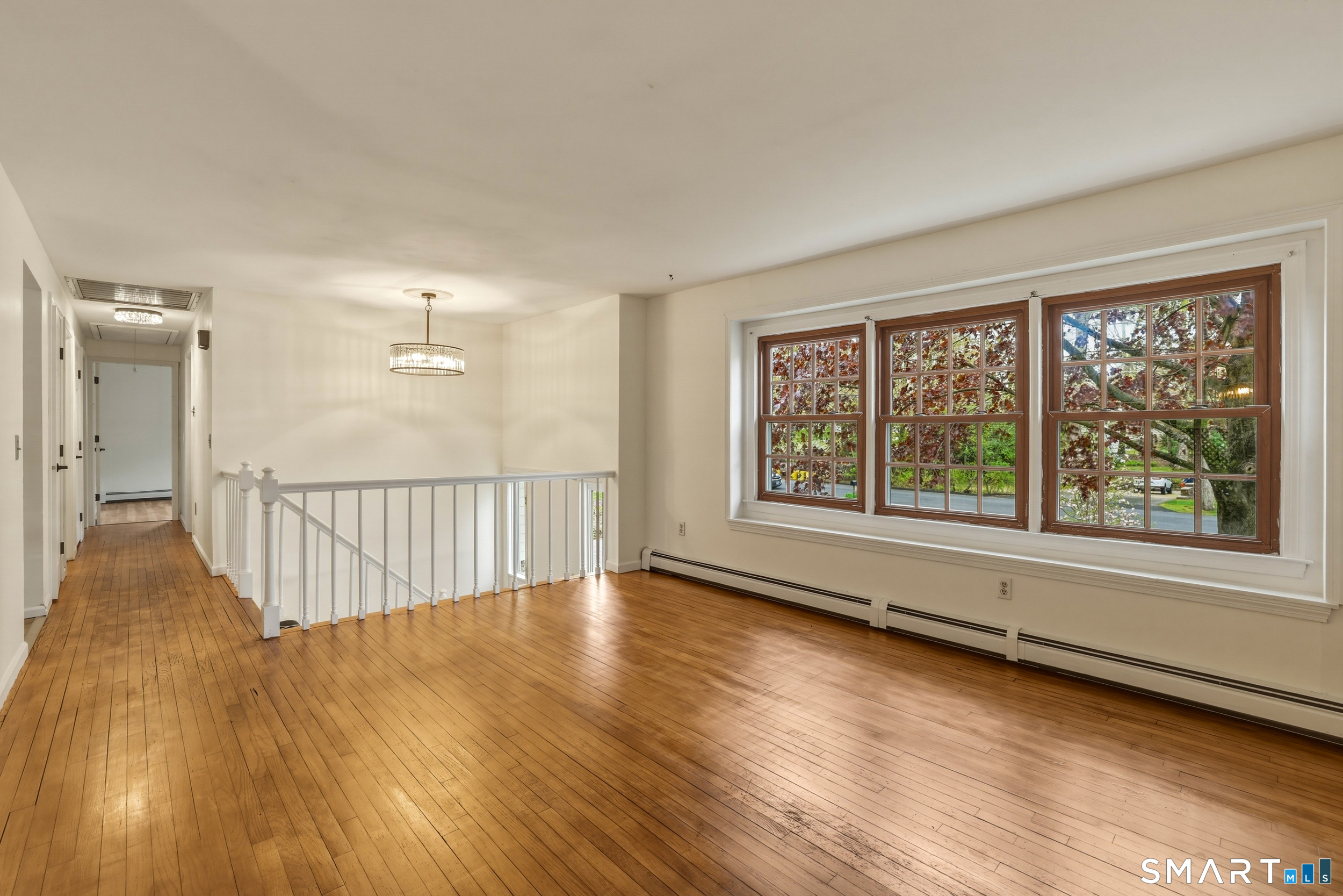 10 Salem Road Madison, CT 06443 - Photo 4 of 31 Large windows allow natural light to flow beautifully into the space.
