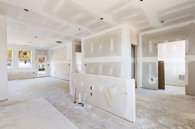a view of a hallway with dining area