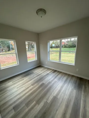 a view of an empty room and window