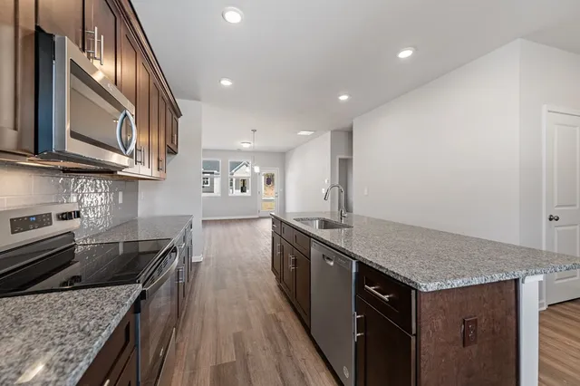 a kitchen with a stove and a sink