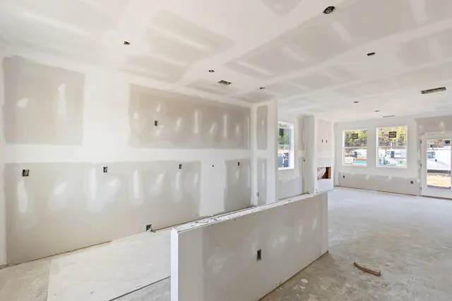a living room with furniture and window