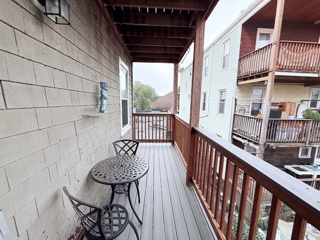 2 A Victoria Street, Unit 2A Boston, MA 02125 - Photo 13 of 13 a view of a balcony with furniture