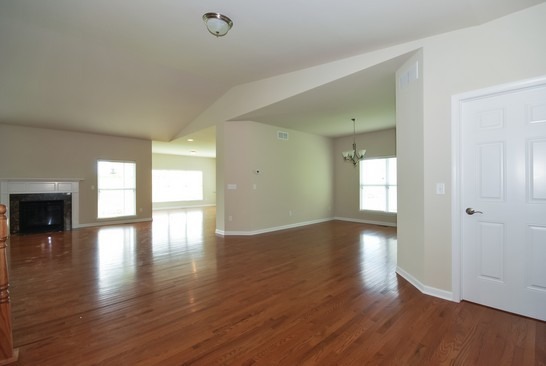 40W221 Palmer Road Geneva, IL 60134 - Photo 11 of 22 a view of an empty room with window and wooden floor