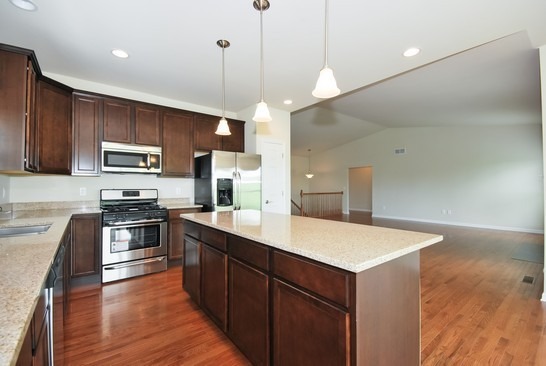 40W221 Palmer Road Geneva, IL 60134 - Photo 18 of 22 a large kitchen with stainless steel appliances kitchen island a large island in the center