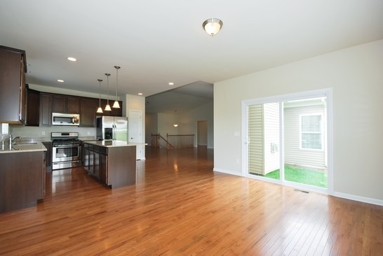 40W221 Palmer Road Geneva, IL 60134 - Photo 20 of 22 a view of kitchen with kitchen island granite countertop wooden cabinets and stainless steel appliances