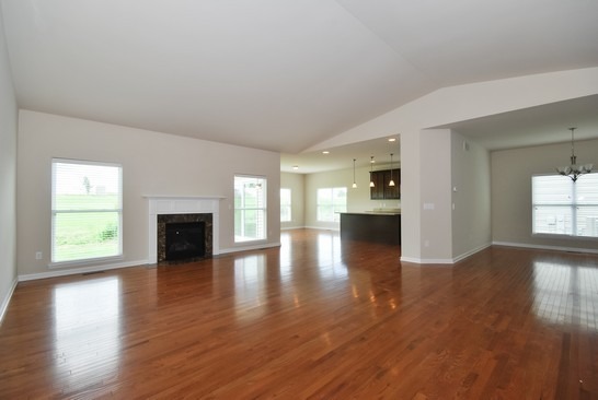 40W221 Palmer Road Geneva, IL 60134 - Photo 9 of 22 a view of empty room with wooden floor and fireplace