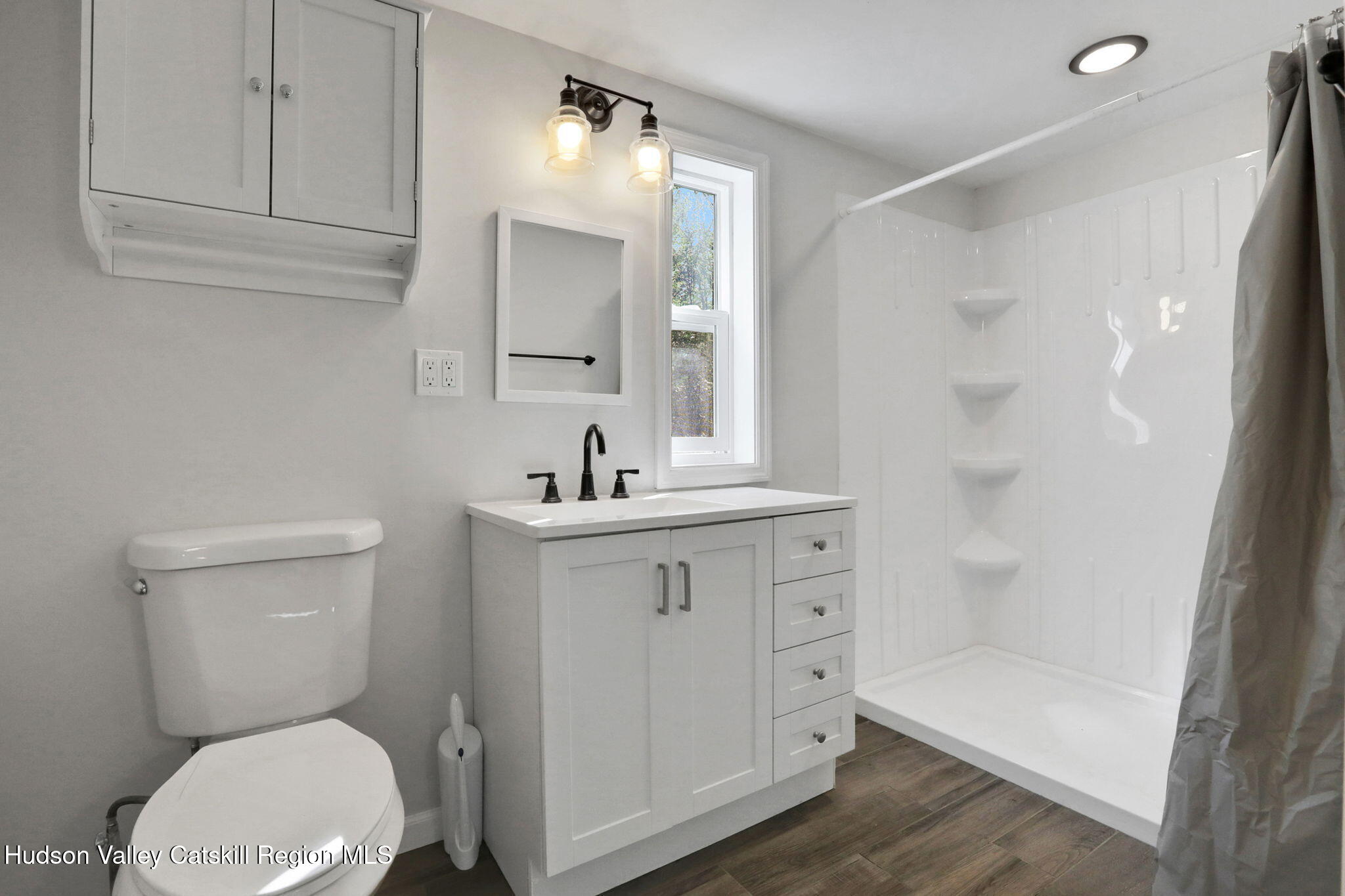 135 Patch Road Saugerties, NY 12477 - Photo 11 of 21 a bathroom with a toilet a sink a mirror and shower