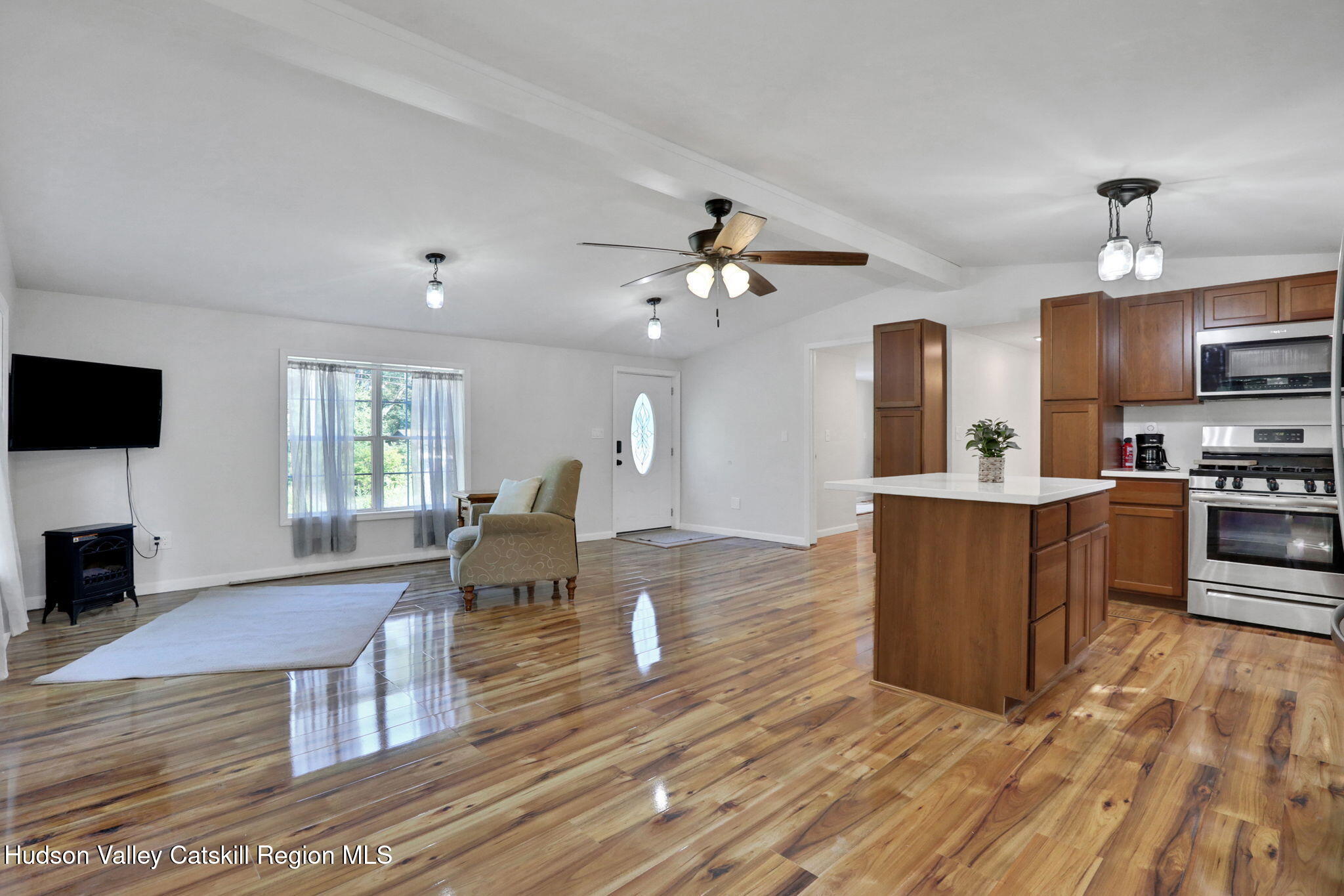 135 Patch Road Saugerties, NY 12477 - Photo 5 of 21 a living room with couches and kitchen view with wooden floor