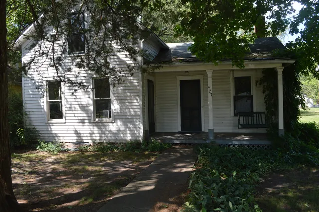 a front view of a house with yard
