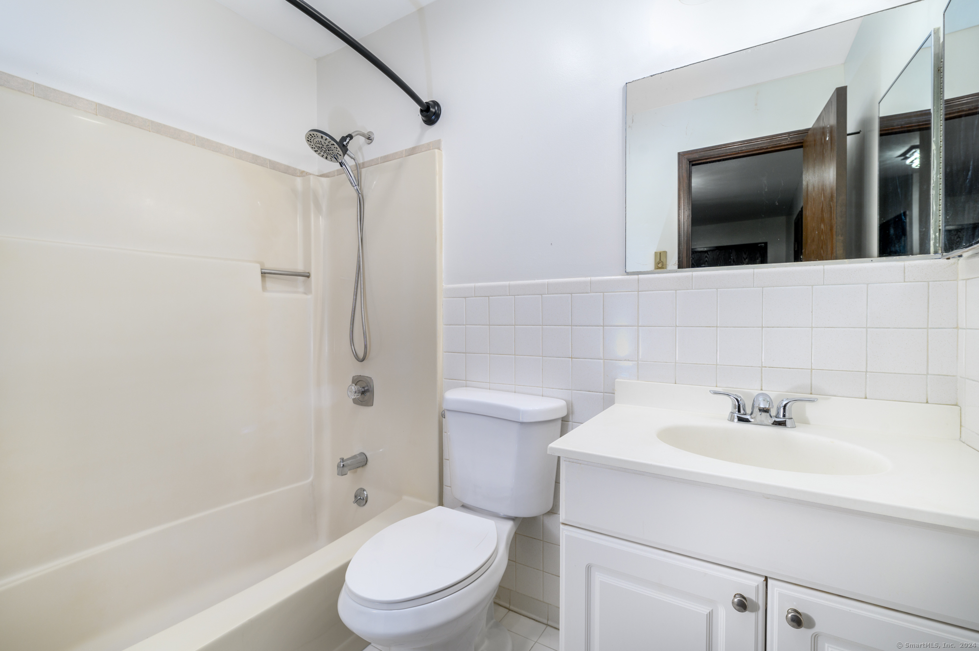 22 Radio Place, Unit 10 Stamford, CT 06906 - Photo 8 of 14 a bathroom with a toilet sink shower and mirror