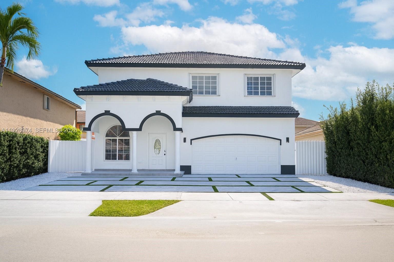 a front view of a house with yard