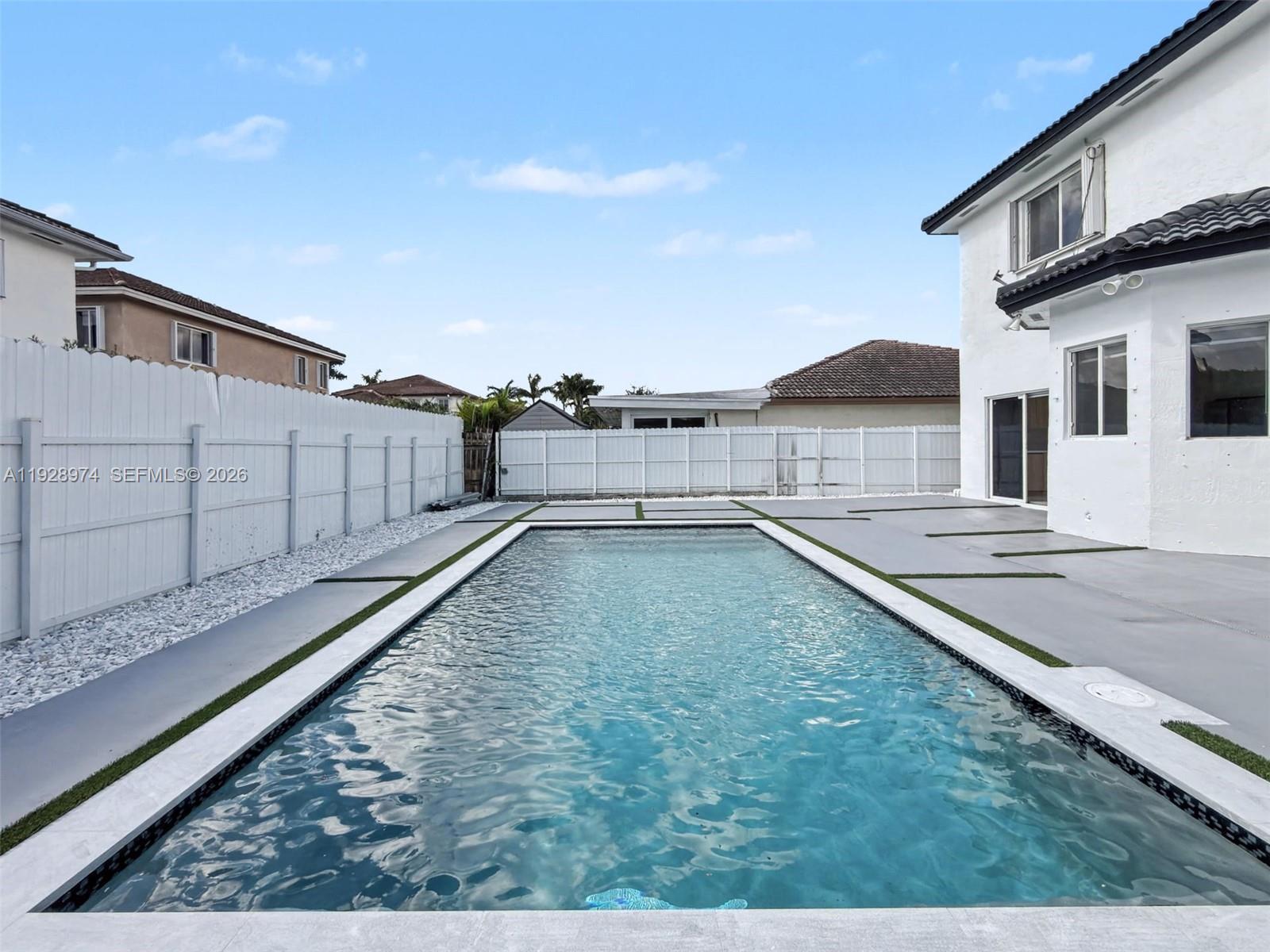 15064 Southwest 30th Terrace Miami, FL 33185 - Photo 12 of 60 a view of a house with a backyard