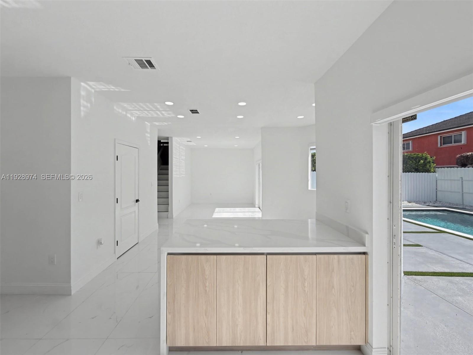 15064 Southwest 30th Terrace Miami, FL 33185 - Photo 14 of 60 a view of a hallway with granite countertop space