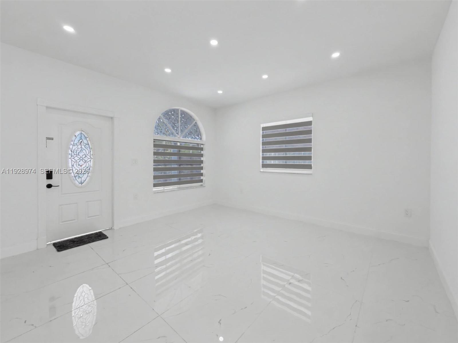 15064 Southwest 30th Terrace Miami, FL 33185 - Photo 19 of 60 an empty room with windows