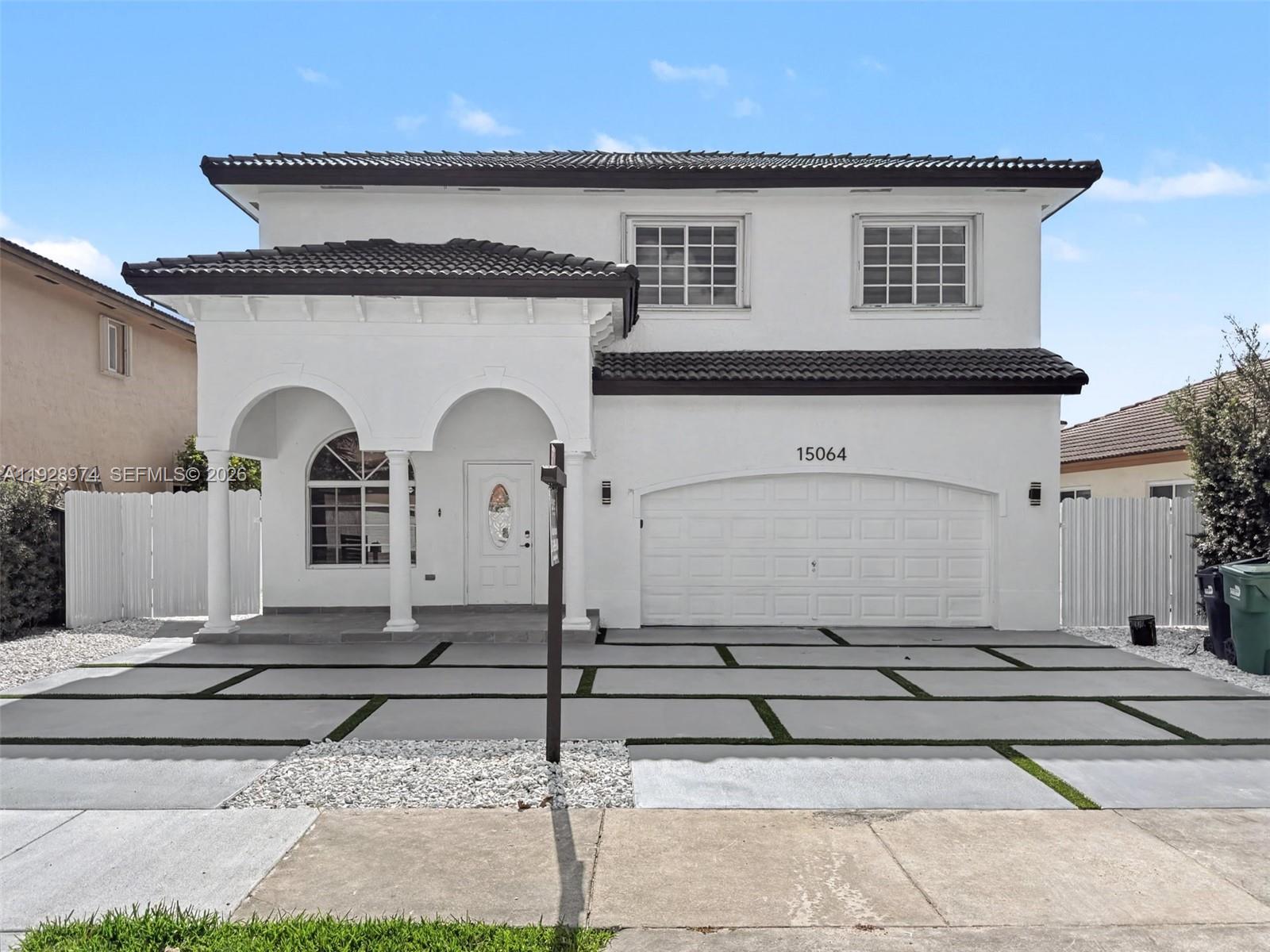 15064 Southwest 30th Terrace Miami, FL 33185 - Photo 2 of 60 a front view of a house