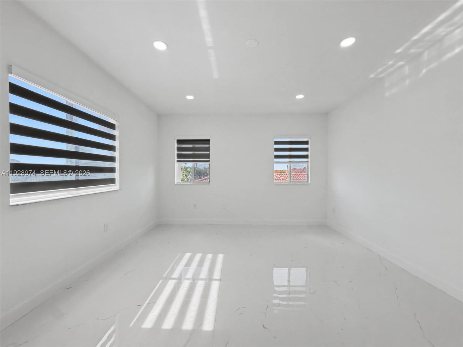 15064 Southwest 30th Terrace Miami, FL 33185 - Photo 28 of 60 a view of empty room with windows