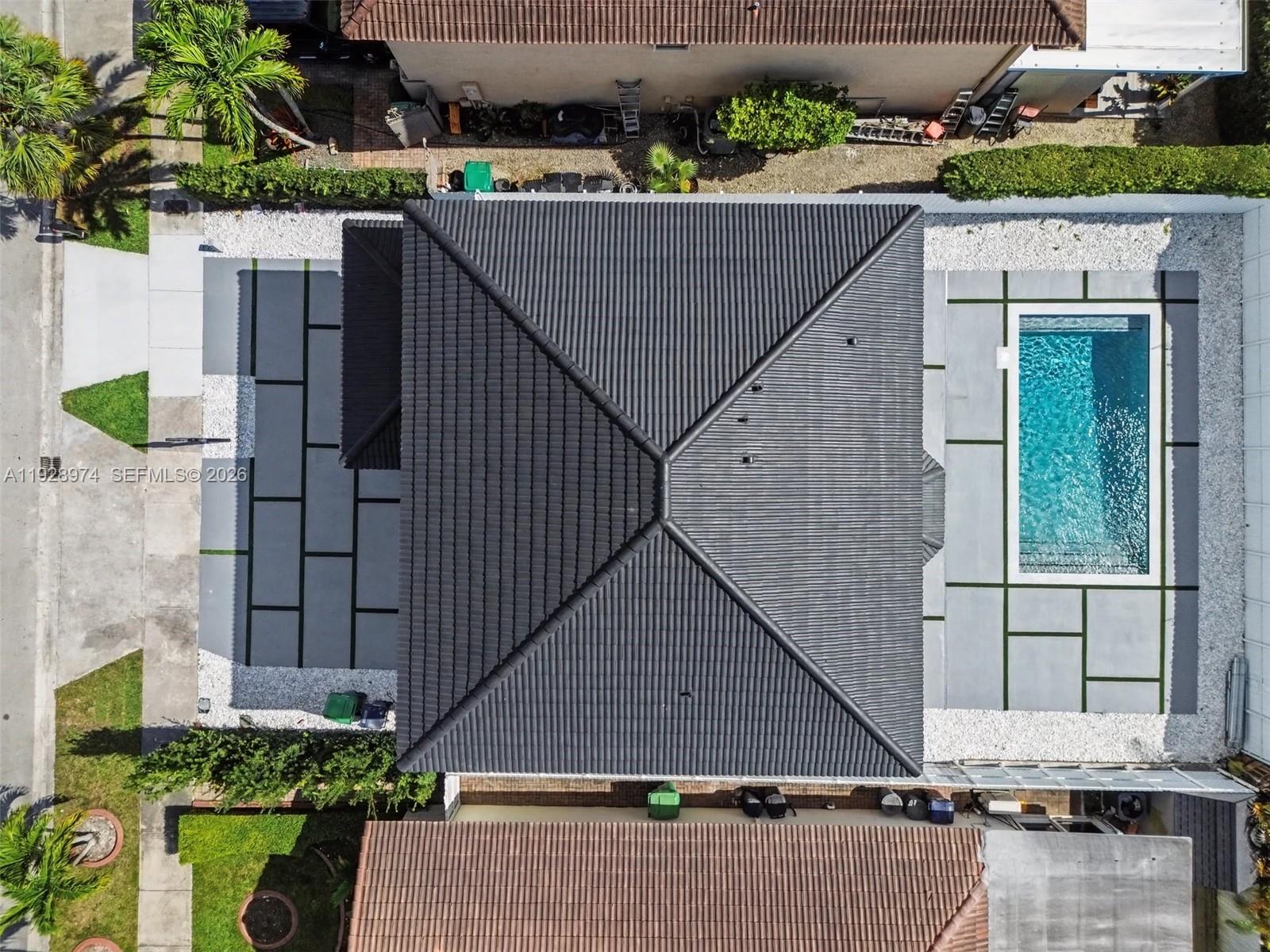 15064 Southwest 30th Terrace Miami, FL 33185 - Photo 29 of 60 a aerial view of a house with a yard and potted plants