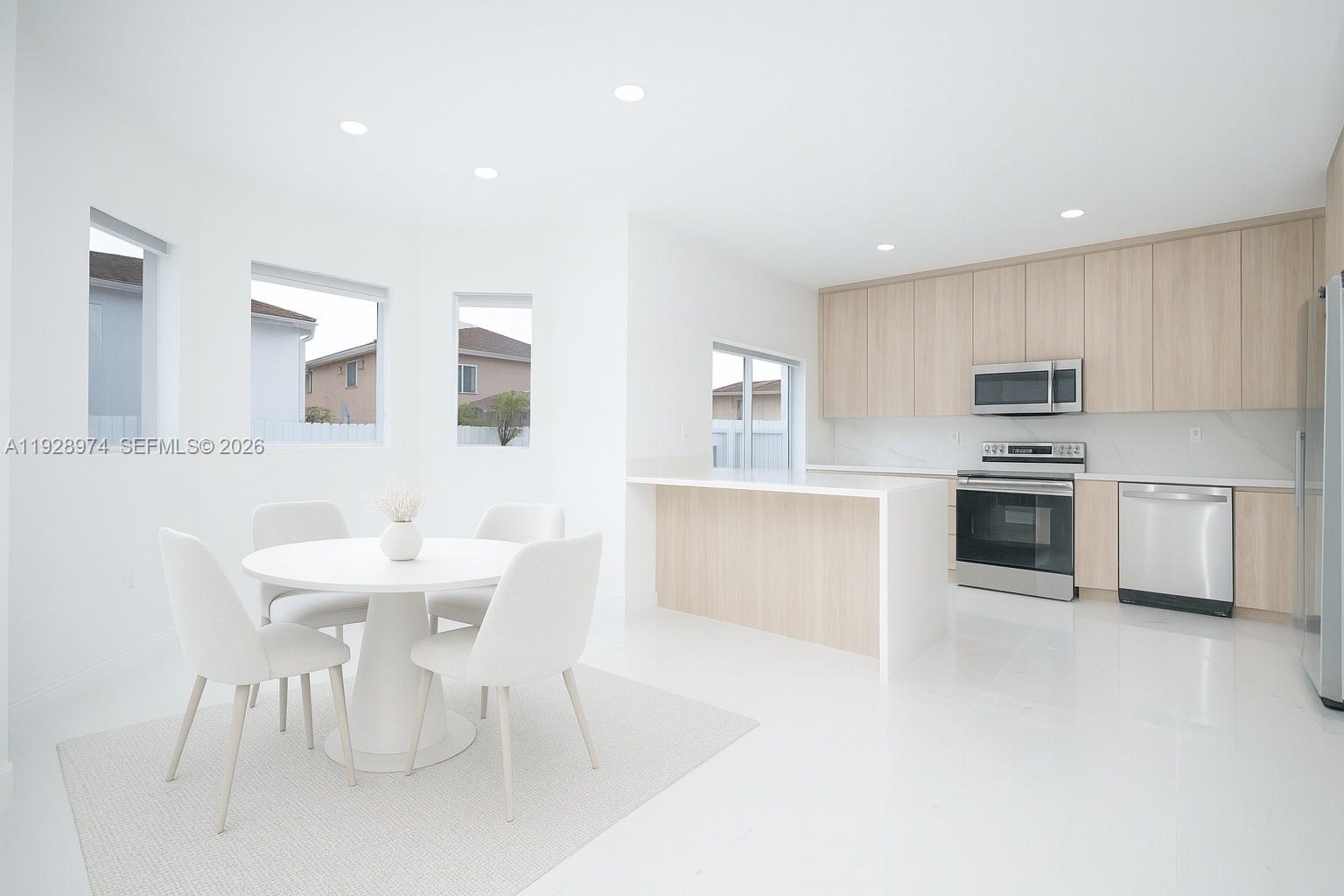 15064 Southwest 30th Terrace Miami, FL 33185 - Photo 34 of 60 a kitchen with granite countertop a sink cabinets and stainless steel appliances