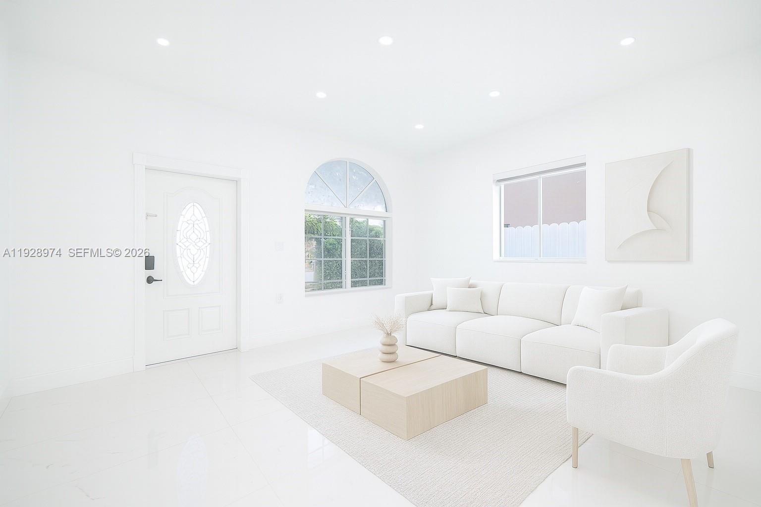 15064 Southwest 30th Terrace Miami, FL 33185 - Photo 37 of 60 a living room with furniture and a large window