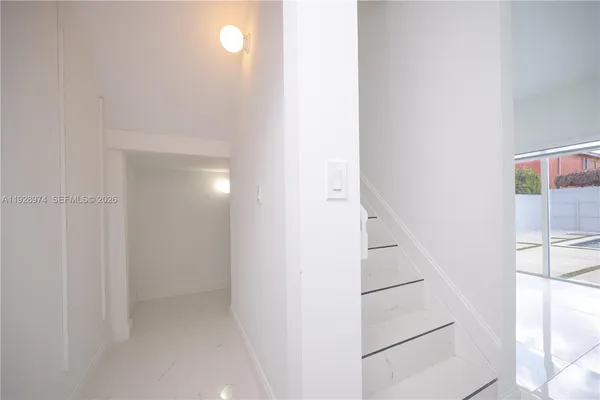 a spacious bathroom with double vanity and a shower