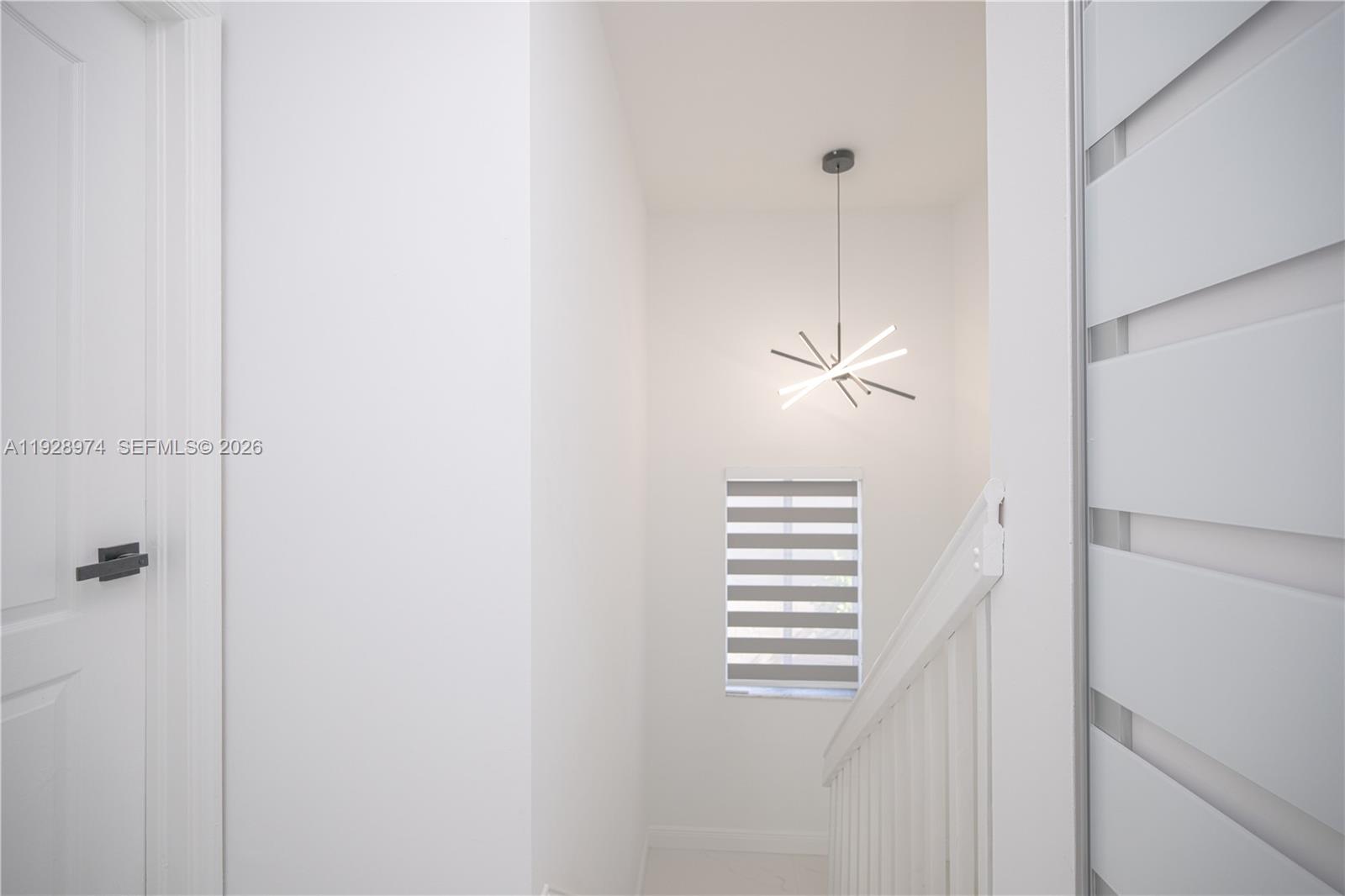 15064 Southwest 30th Terrace Miami, FL 33185 - Photo 39 of 60 a view of a hallway with a window