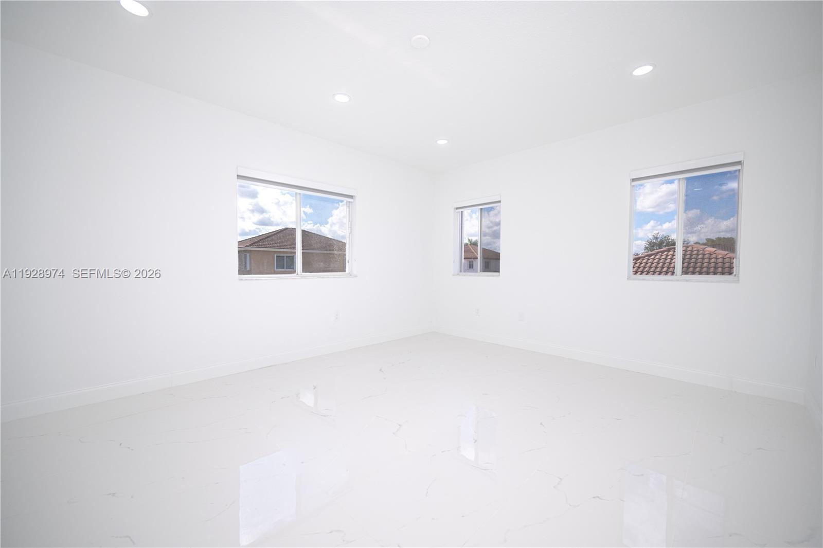 15064 Southwest 30th Terrace Miami, FL 33185 - Photo 40 of 60 an empty room with windows