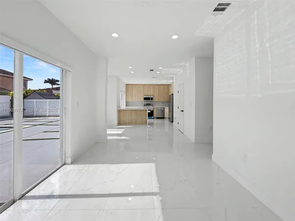 a view of kitchen with furniture and cabinet