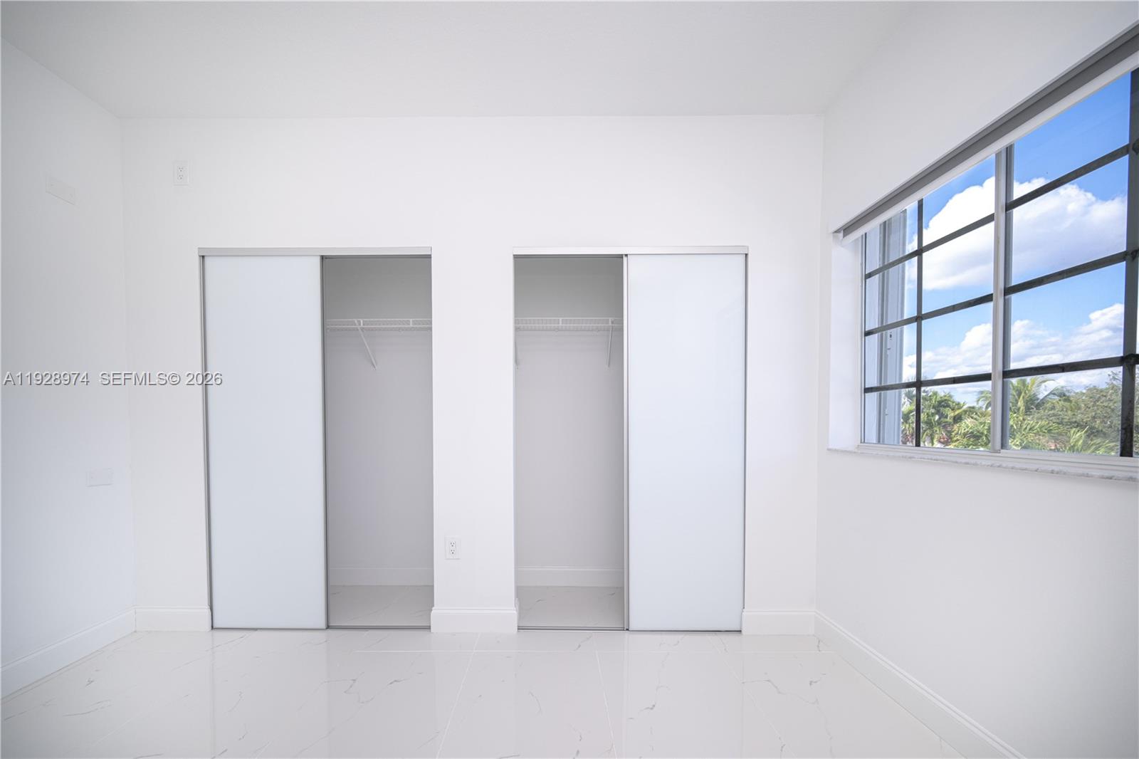 15064 Southwest 30th Terrace Miami, FL 33185 - Photo 51 of 60 an empty room with windows