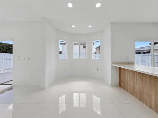 a kitchen with stainless steel appliances a stove a sink and a microwave