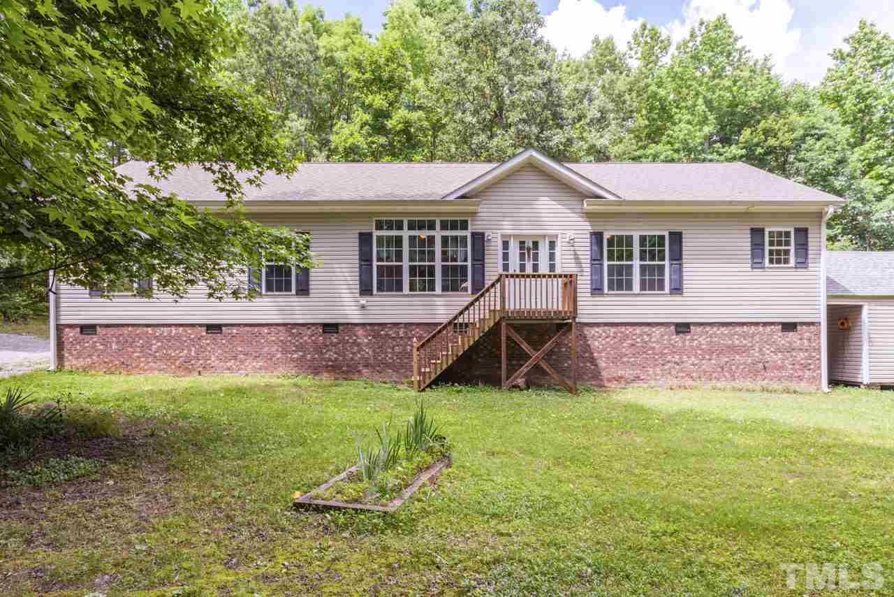 2092 Suitts Store Road Franklinton, NC 27525 - Photo 1 of 21 a view of a house with a yard and a porch