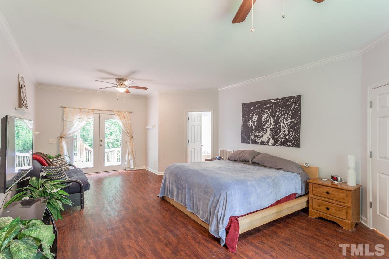 2092 Suitts Store Road Franklinton, NC 27525 - Photo 11 of 21 a bedroom with a bed and a large window