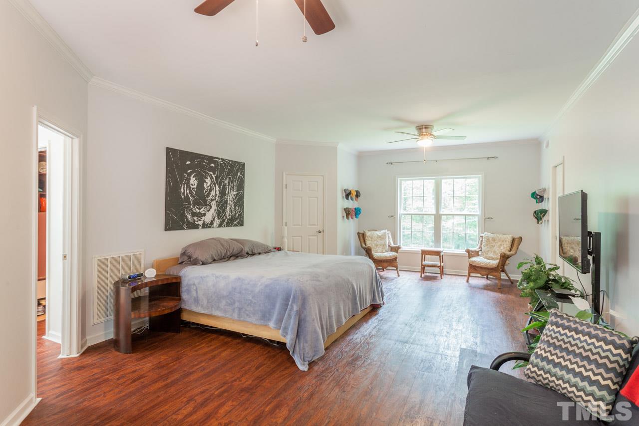 2092 Suitts Store Road Franklinton, NC 27525 - Photo 12 of 21 a bedroom with a bed and wooden floor