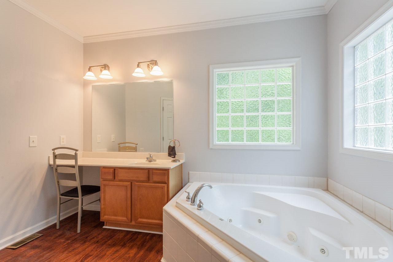 2092 Suitts Store Road Franklinton, NC 27525 - Photo 13 of 21 a bathroom with a tub sink and a window