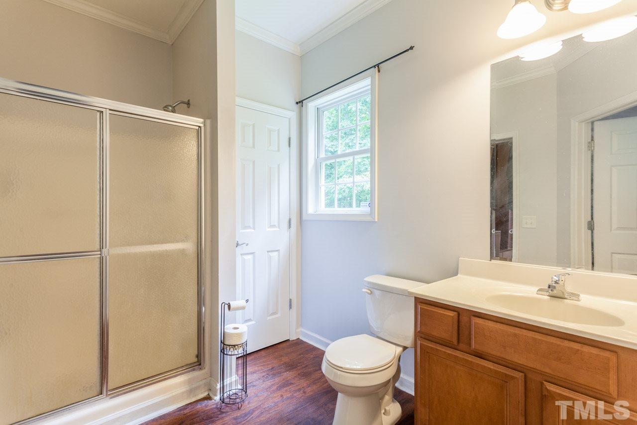 2092 Suitts Store Road Franklinton, NC 27525 - Photo 14 of 21 a bathroom with a sink toilet and shower