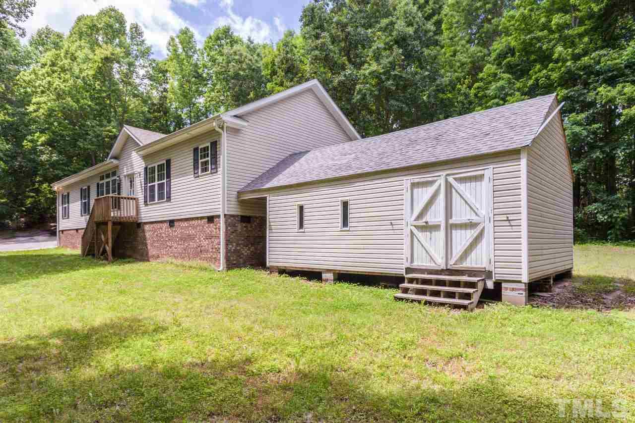 2092 Suitts Store Road Franklinton, NC 27525 - Photo 15 of 21 a house with garden in front of it