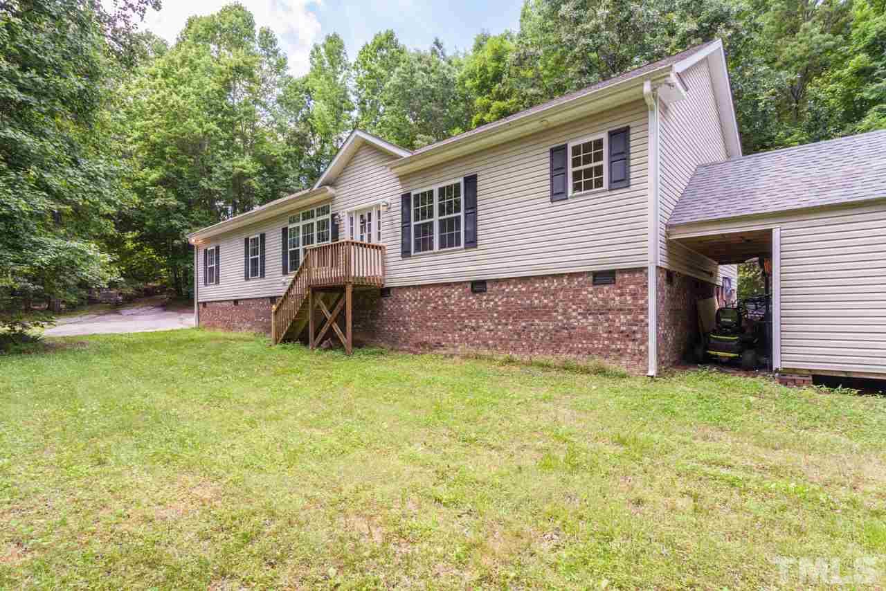 2092 Suitts Store Road Franklinton, NC 27525 - Photo 16 of 21 a view of a house with backyard and garden