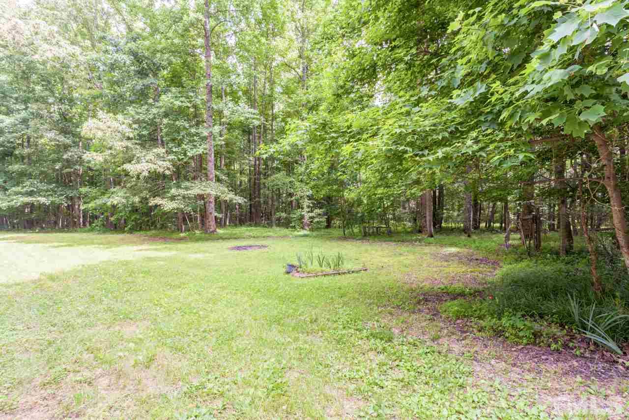 2092 Suitts Store Road Franklinton, NC 27525 - Photo 19 of 21 a big yard with large trees