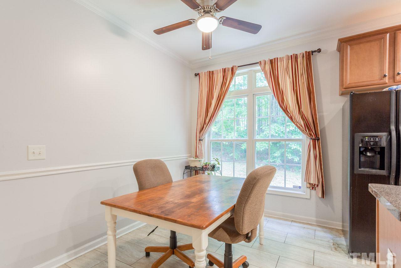 2092 Suitts Store Road Franklinton, NC 27525 - Photo 9 of 21 a workspace with furniture and a window