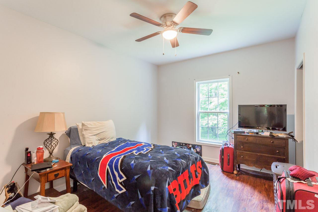 2092 Suitts Store Road Franklinton, NC 27525 - Photo 10 of 21 a bedroom with a bed and a flat screen tv