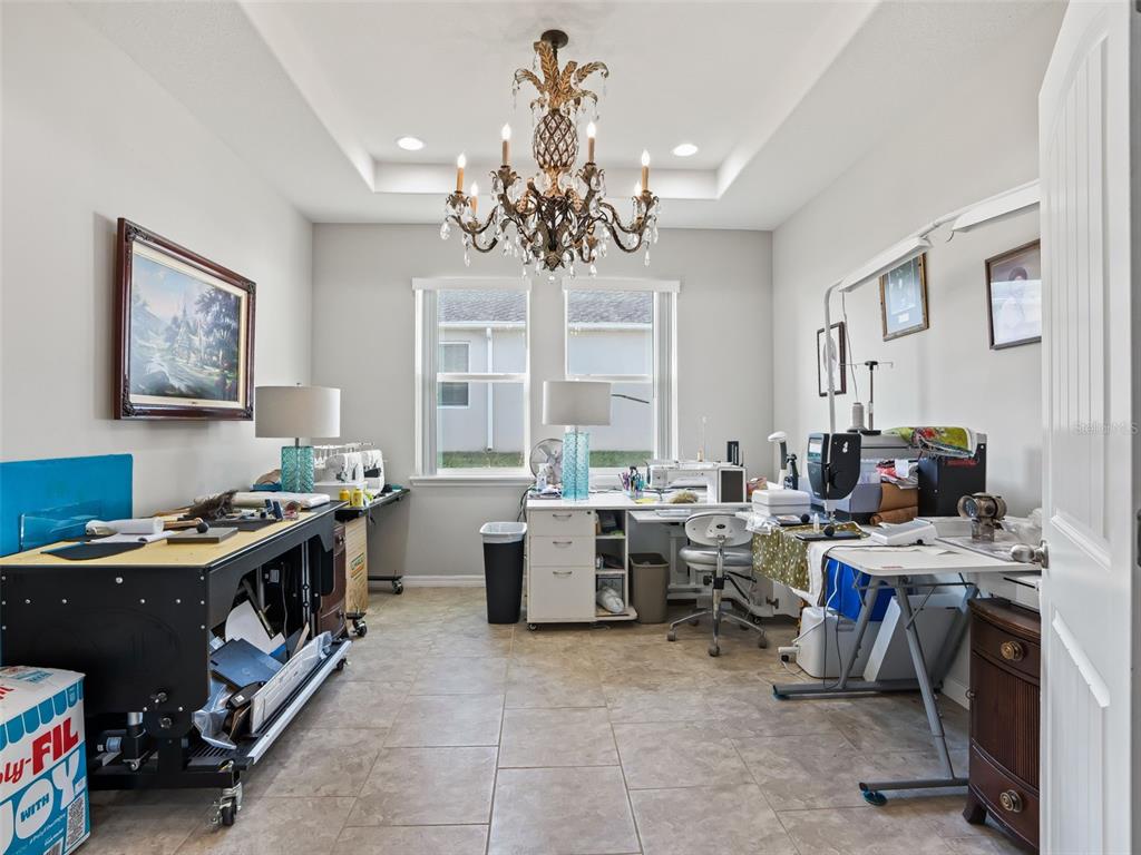 5626 Southwest 50th Court Ocala, FL 34474 - Photo 17 of 33 a view of a workspace with furniture and a window