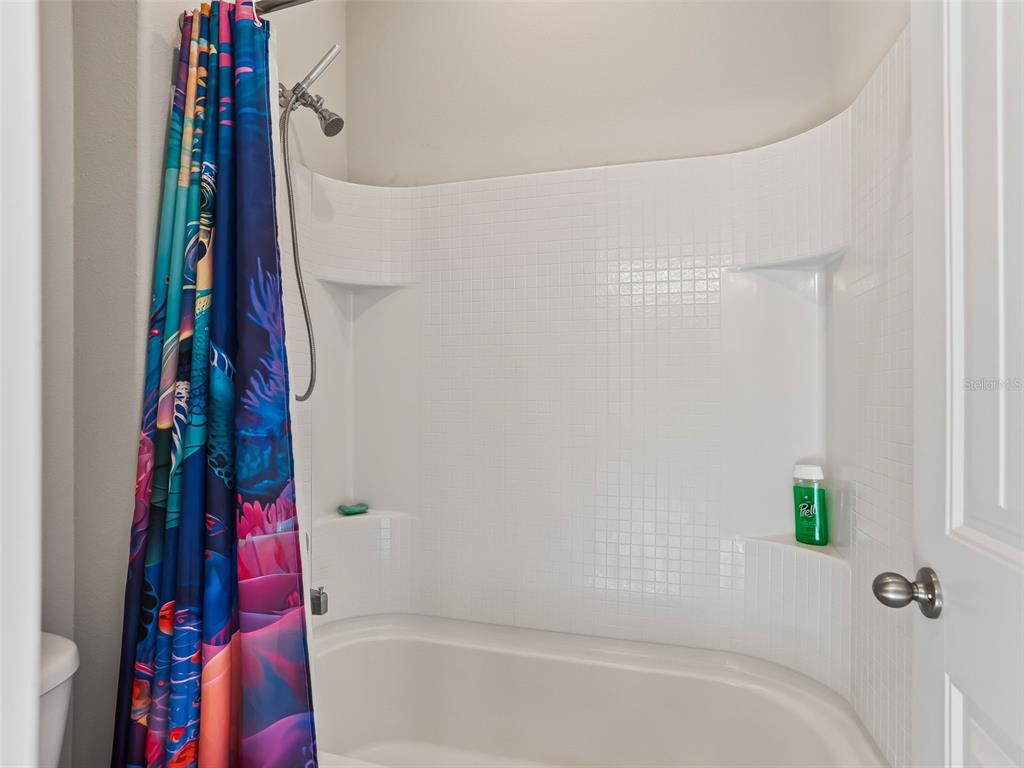 5626 Southwest 50th Court Ocala, FL 34474 - Photo 20 of 33 a bathroom with a bathtub and shower