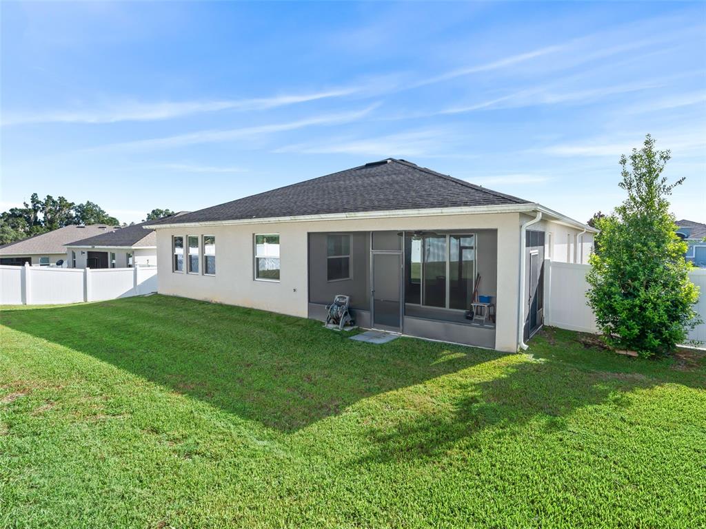 5626 Southwest 50th Court Ocala, FL 34474 - Photo 26 of 33 a view of a house with a yard and porch