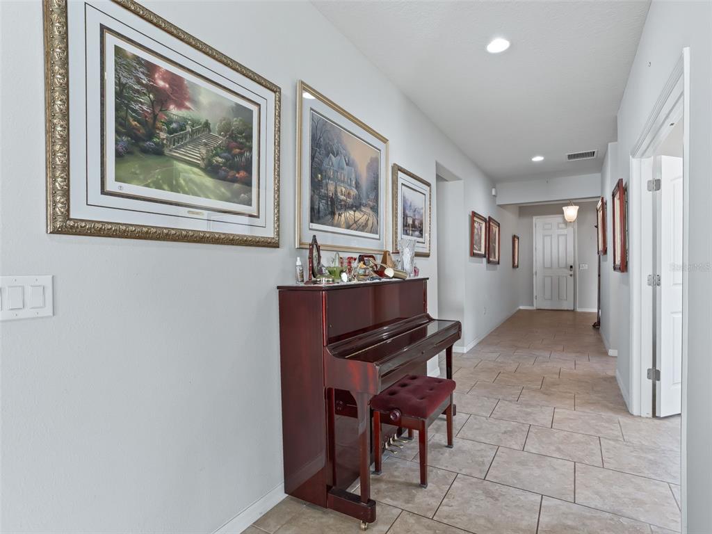 5626 Southwest 50th Court Ocala, FL 34474 - Photo 5 of 33 a view of a hallway with furniture and windows