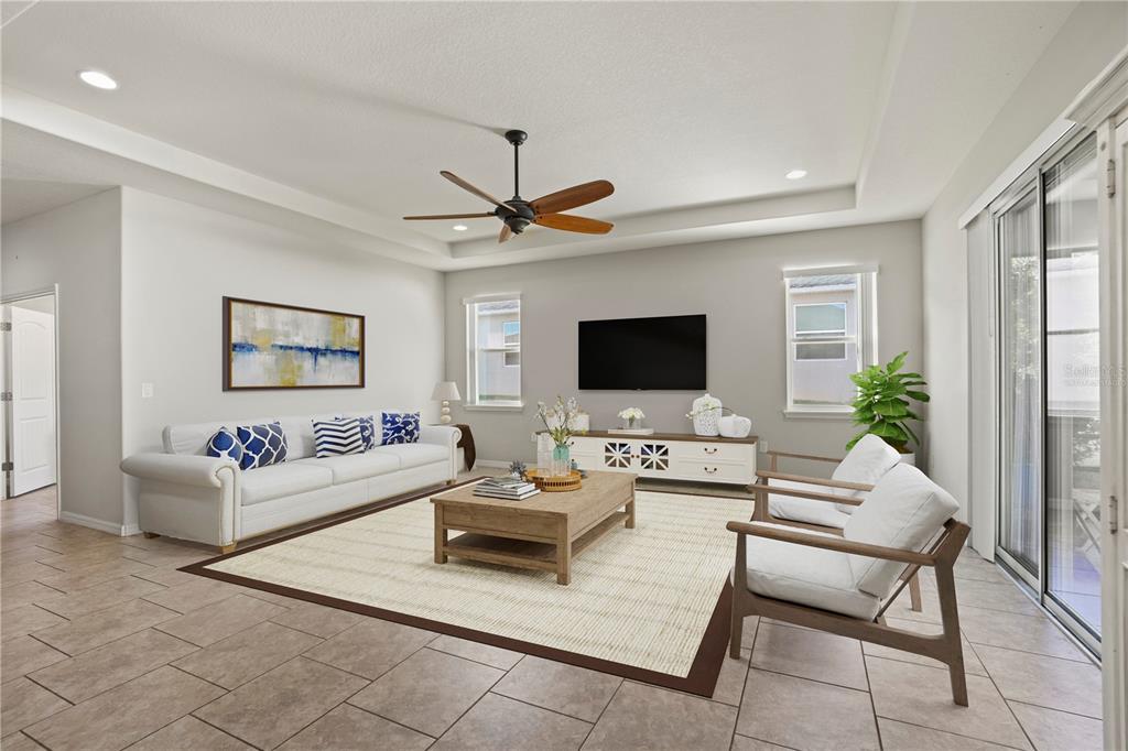 5626 Southwest 50th Court Ocala, FL 34474 - Photo 6 of 33 a living room with furniture and a flat screen tv